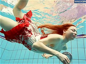 molten polish redhead swimming in the pool